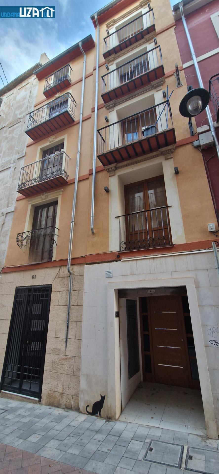 Investment Opportunity: Refurbished Building Steps from the University