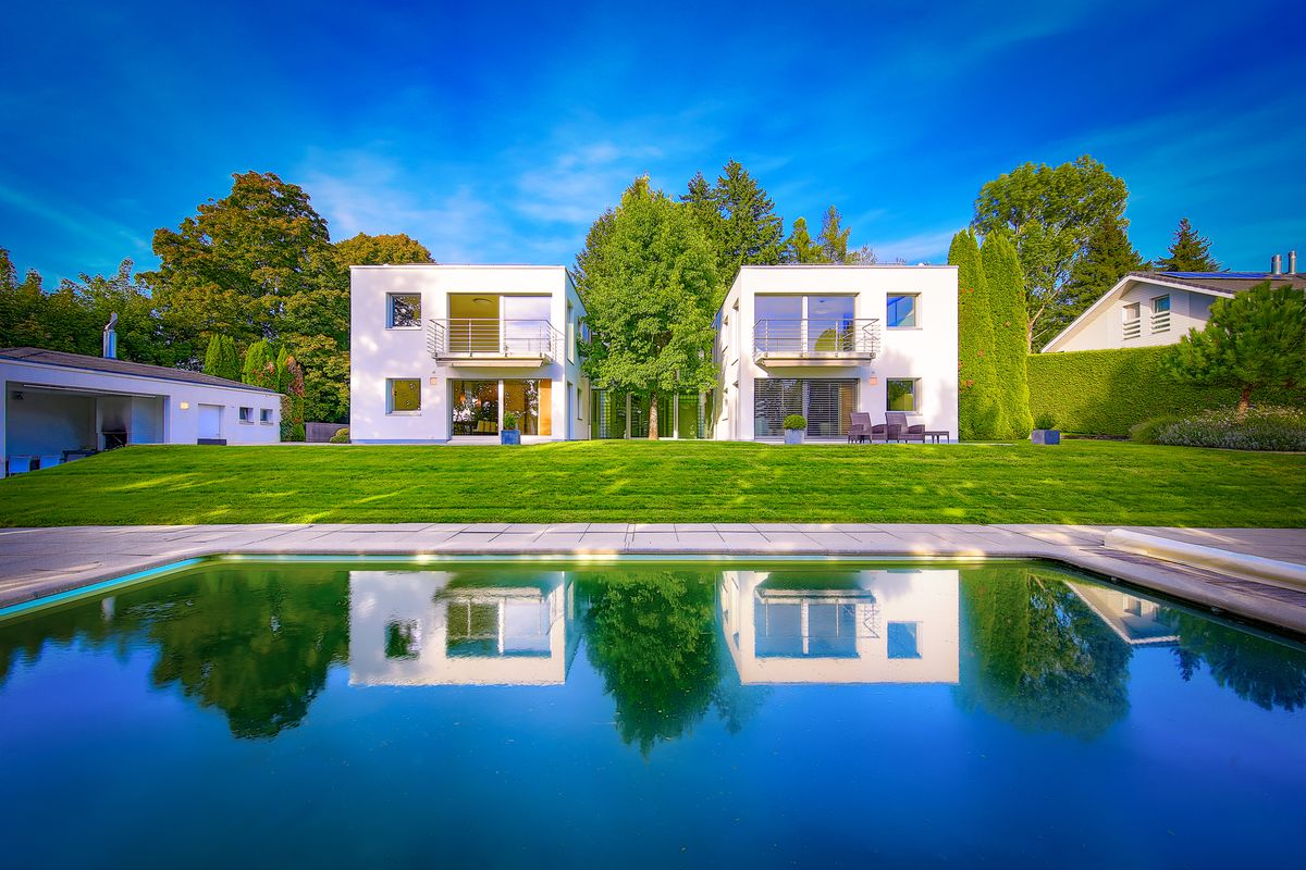 Contemporary architect-designed villa with swimming pool in a green setting