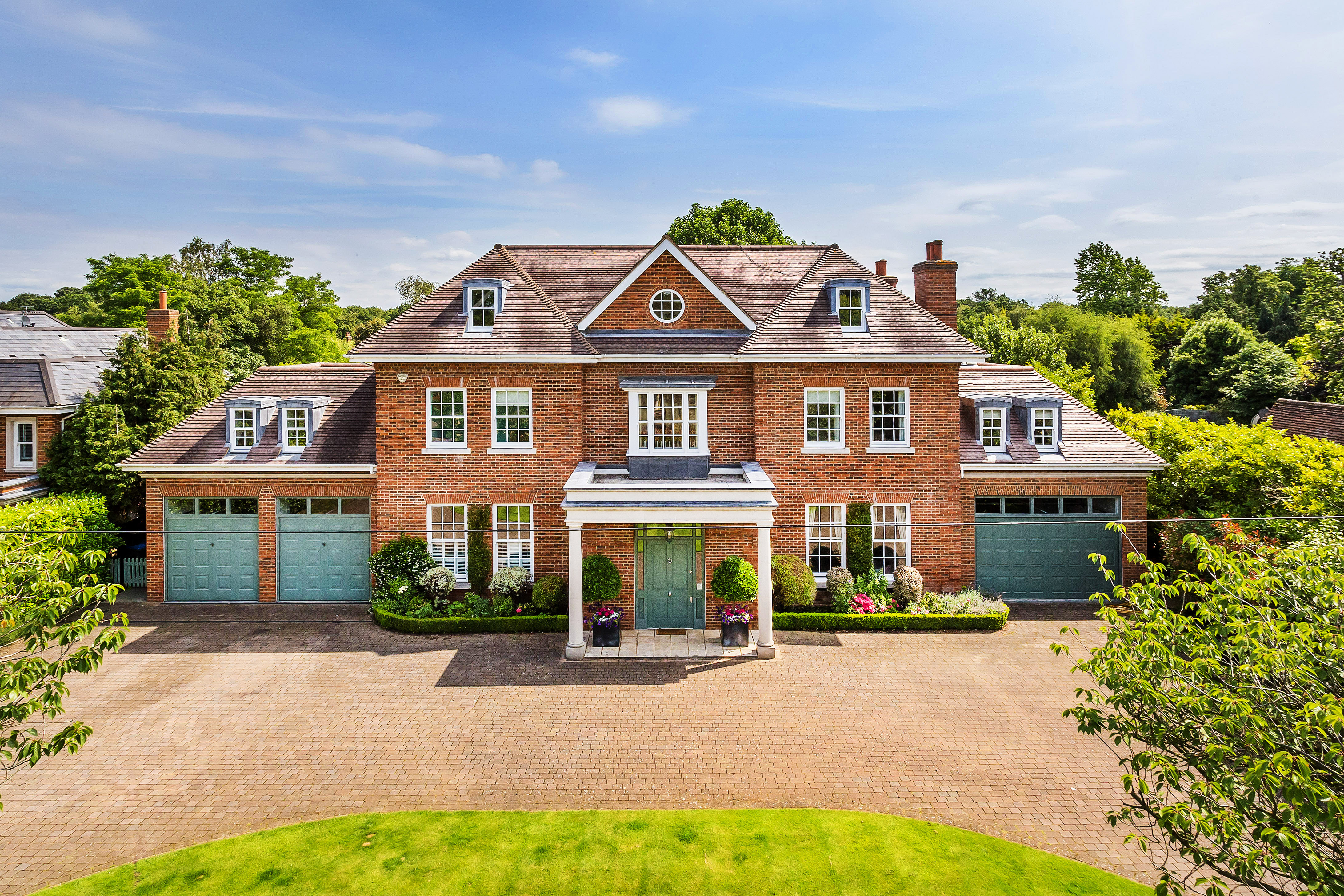 A landmark family home on one of Esher’s most prestigious private roads